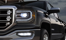 Picture showing advanced lighting featured on the 2017 GMC Sierra 1500 light-duty truck.