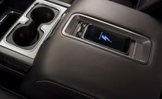 Picture showing wireless charging pad on top of the 2017 GMC Sierra 1500 pickup truck's center console.