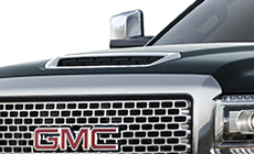 Image of the hood scoop induction system 2017 Sierra 2500 Denali HD, providing cooler airflow to the engine.